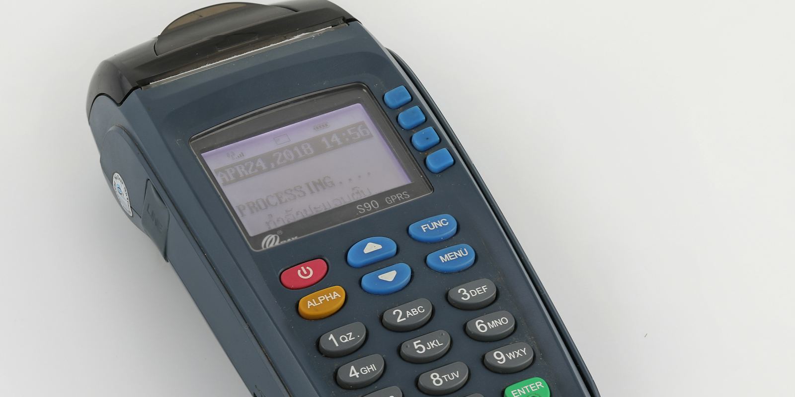 A card payment terminal on a shop counter