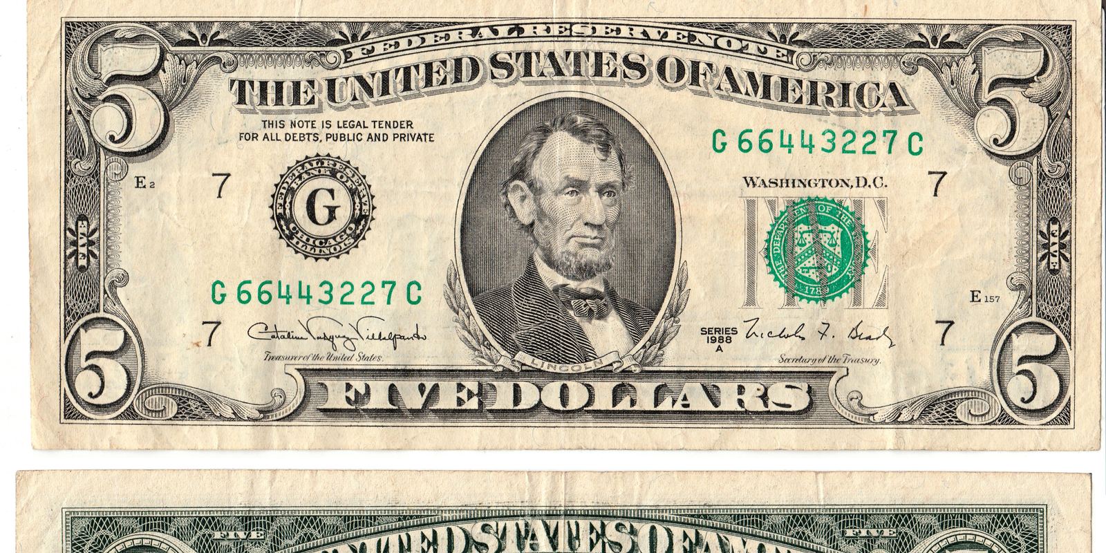 Two US five dollar bills, front and back