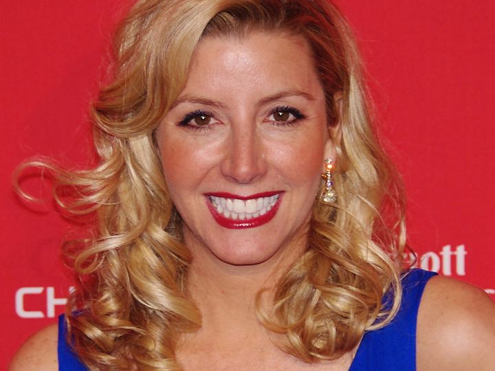 Spanx founder Sara Blakely smiling at a 2012 event